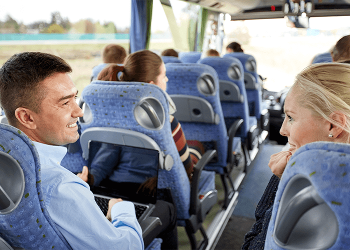 Group Trip or Tour on Coach Bus Laptop Entertainment